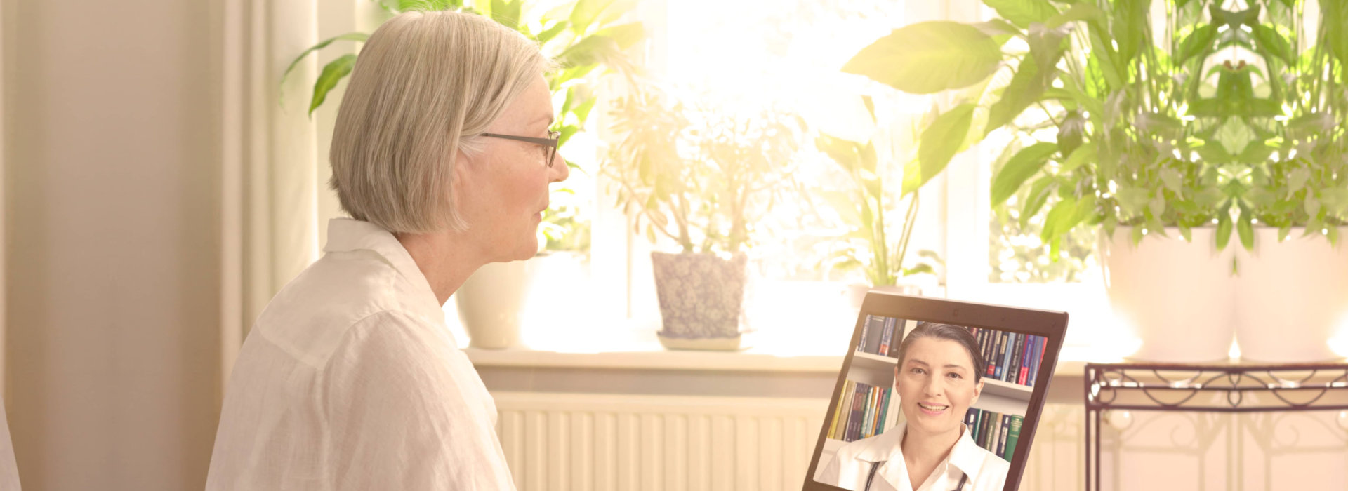 senior woman talking to a medical professional